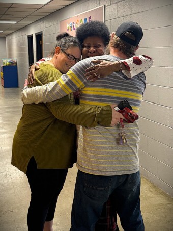 a group of people hugging