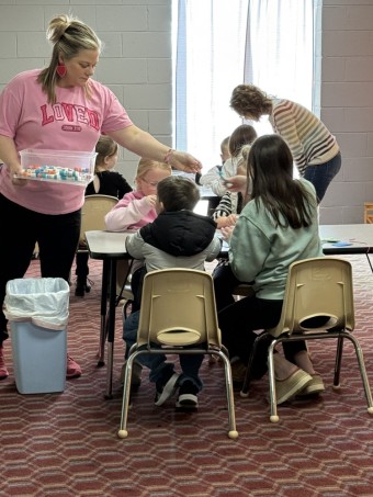 a woman leading a kids class