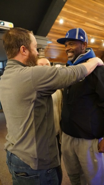 two men embracing each other