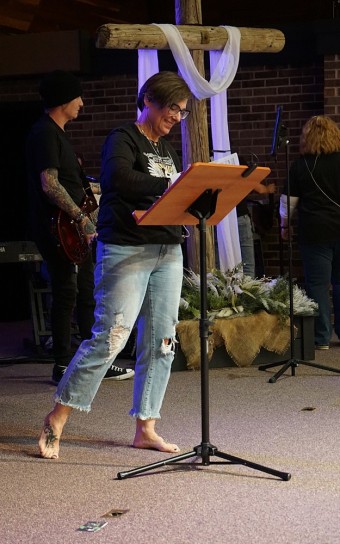 a woman preparing to sing on a stage